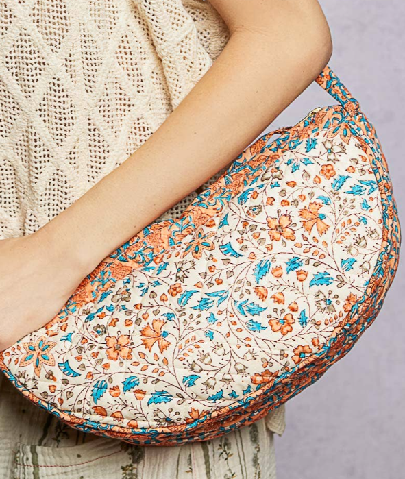 Ethnic-style quilted half-moon crossbody bag