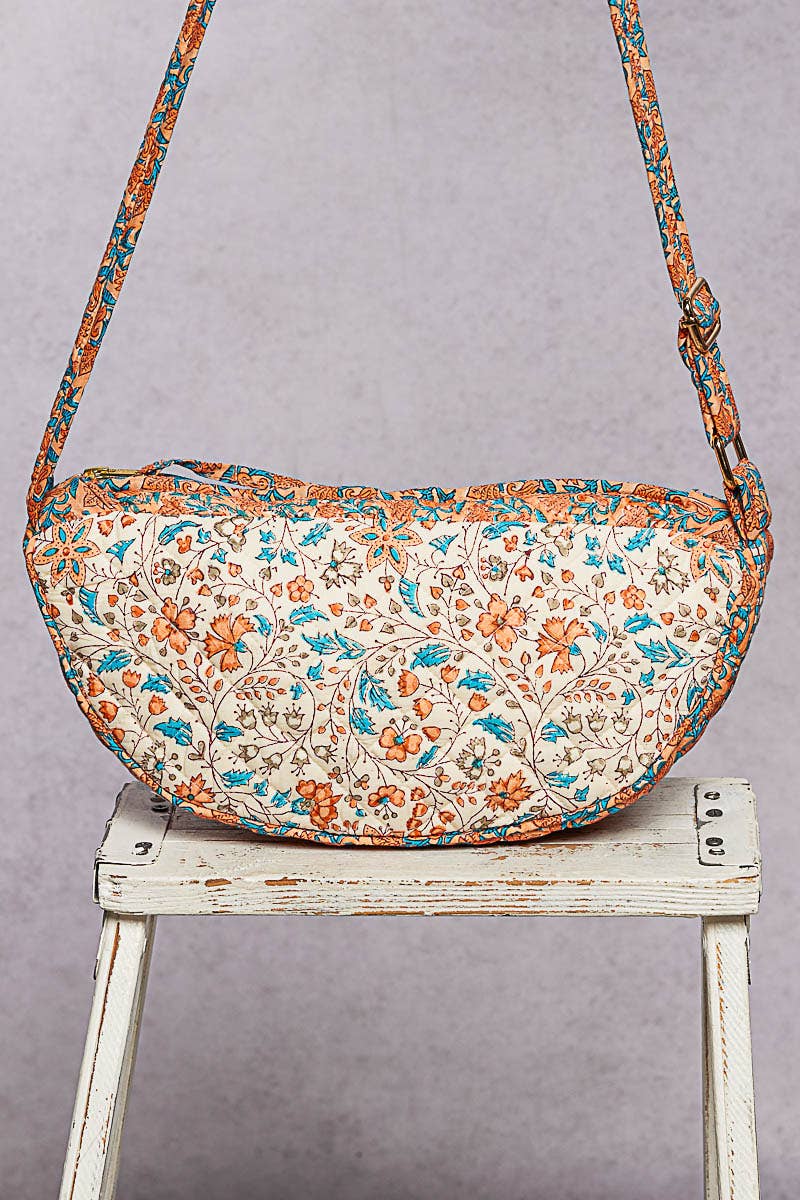 Ethnic-style quilted half-moon crossbody bag
