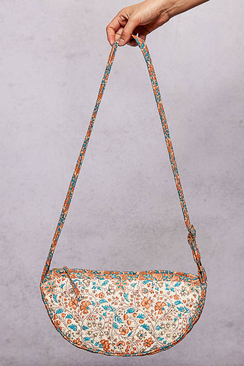 Ethnic-style quilted half-moon crossbody bag