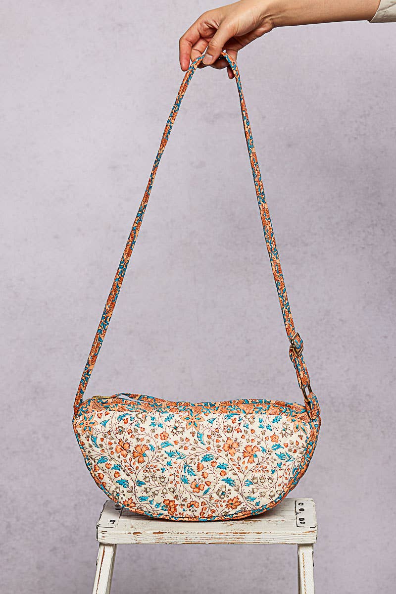 Ethnic-style quilted half-moon crossbody bag