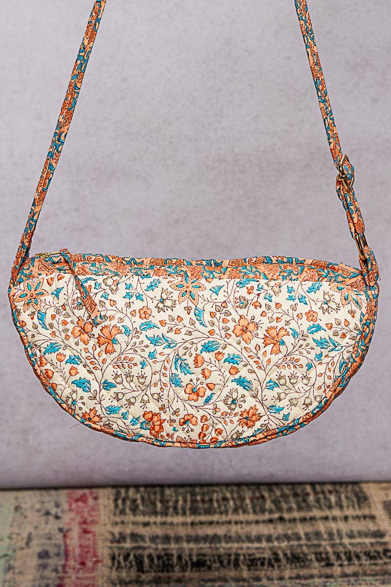 Ethnic-style quilted half-moon crossbody bag